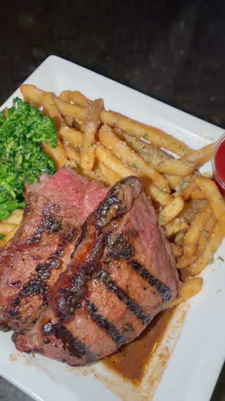 Pub 235 Steak Frites with fries and grilled broccolini